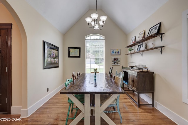 3510 Notting Hill Cir, Joplin, MO 64804 - dining room featuring arched walkways, light wood-style floors, a chandelier, and lofted ceiling