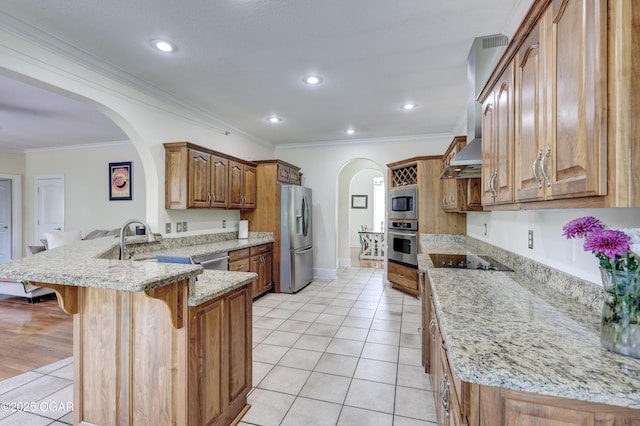 3510 Notting Hill Cir, Joplin, MO 64804 - kitchen with appliances with stainless steel finishes, a peninsula, arched walkways, a breakfast bar, and crown molding