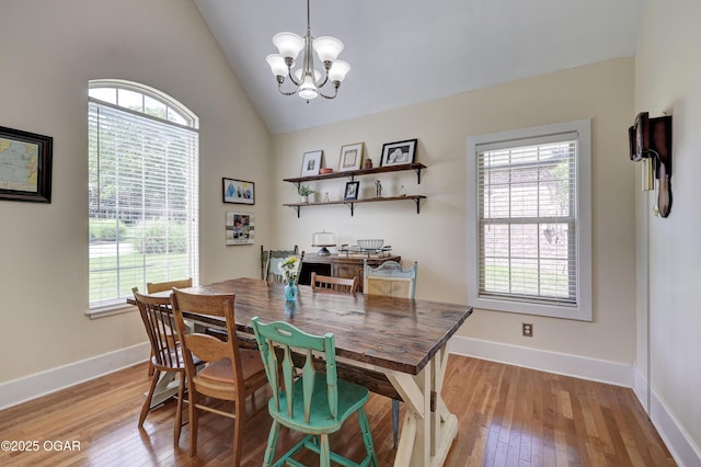 3510 Notting Hill Cir, Joplin, MO 64804 - dining area with light wood-style flooring, a chandelier, and high vaulted ceiling