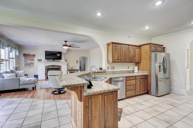 3510 Notting Hill Cir, Joplin, MO 64804 - kitchen featuring stainless steel appliances, arched walkways, a peninsula, light tile patterned floors, and open floor plan