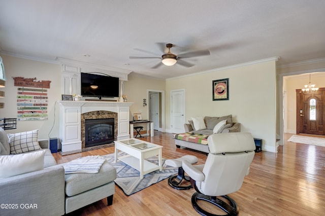 3510 Notting Hill Cir, Joplin, MO 64804 - living room featuring a ceiling fan, light wood-type flooring, a premium fireplace, and ornamental molding
