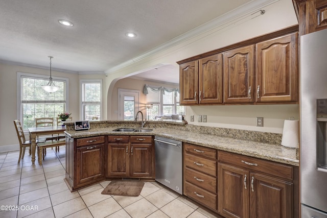 3510 Notting Hill Cir, Joplin, MO 64804 - kitchen with stainless steel appliances, ornamental molding, light stone counters, arched walkways, and light tile patterned flooring