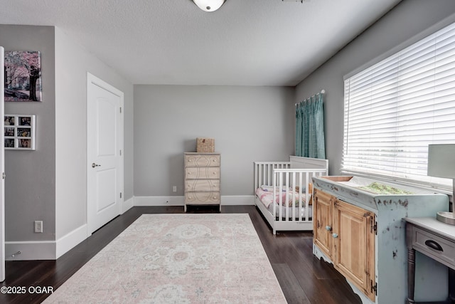 3510 Notting Hill Cir, Joplin, MO 64804 - bedroom with dark wood-style flooring and a textured ceiling