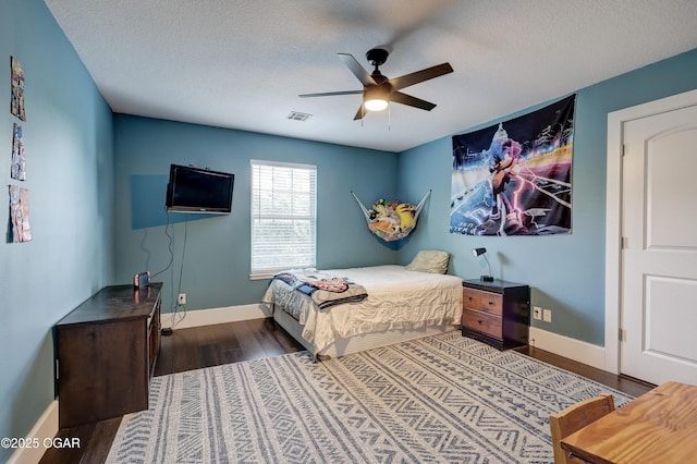 3510 Notting Hill Cir, Joplin, MO 64804 - bedroom featuring wood finished floors, a textured ceiling, and a ceiling fan