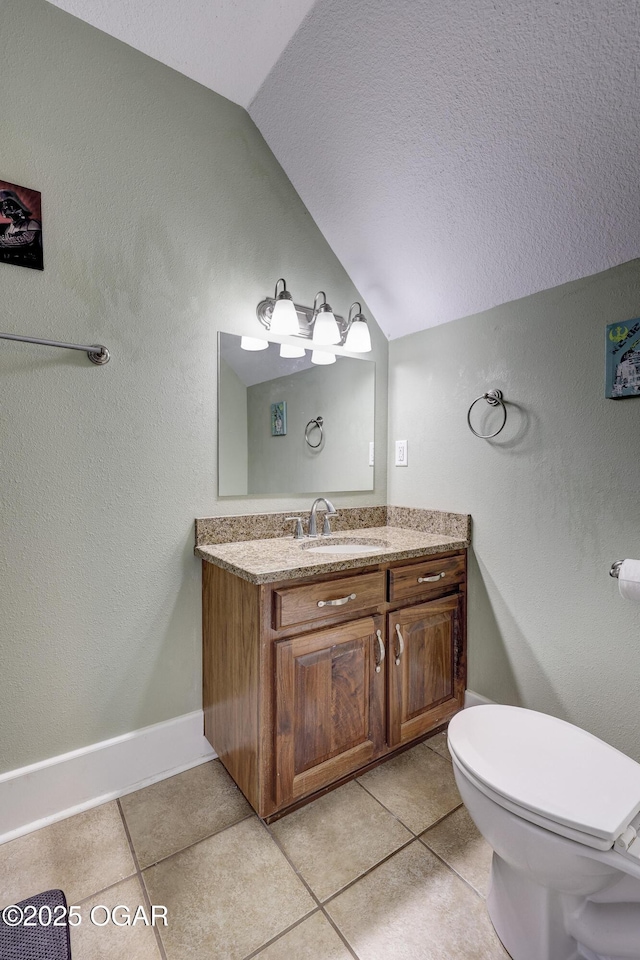 3510 Notting Hill Cir, Joplin, MO 64804 - bathroom with lofted ceiling, vanity, tile patterned floors, and a textured wall