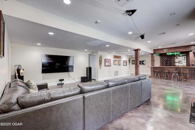 3510 Notting Hill Cir, Joplin, MO 64804 - living area with a bar, recessed lighting, and decorative columns