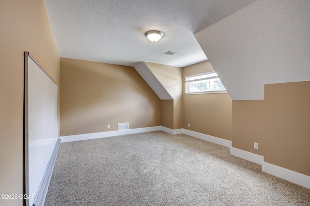 3510 Notting Hill Cir, Joplin, MO 64804 - bonus room featuring a textured ceiling, carpet flooring, and vaulted ceiling