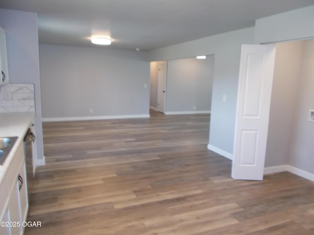 2705 S Michigan Ave, Joplin, MO 64804 - kitchen with white cabinetry, wood finished floors, and light countertops