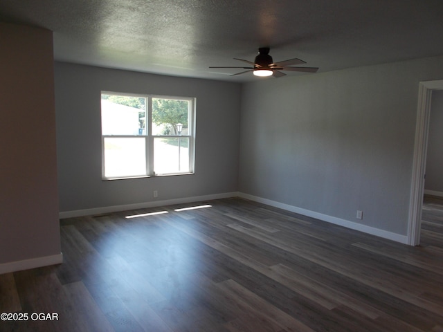 2705 S Michigan Ave, Joplin, MO 64804 - unfurnished room featuring a ceiling fan, dark wood-style flooring, and a textured ceiling