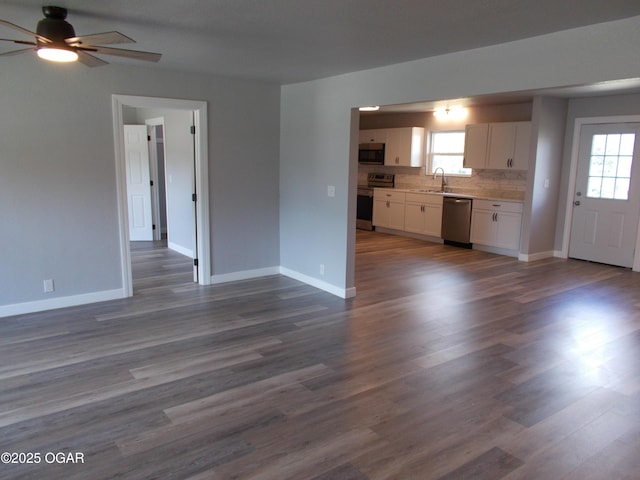 2705 S Michigan Ave, Joplin, MO 64804 - unfurnished living room with a ceiling fan and dark wood-type flooring