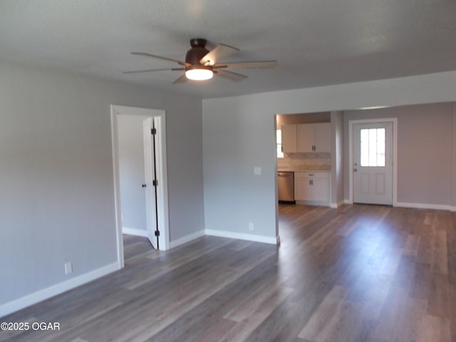 2705 S Michigan Ave, Joplin, MO 64804 - unfurnished living room featuring ceiling fan and dark wood finished floors