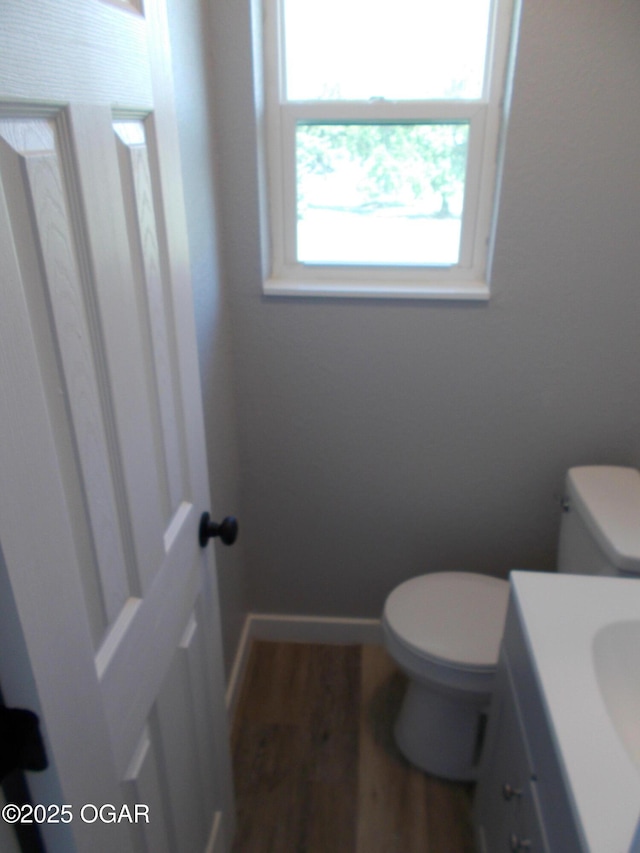 2705 S Michigan Ave, Joplin, MO 64804 - half bathroom with vanity and wood finished floors
