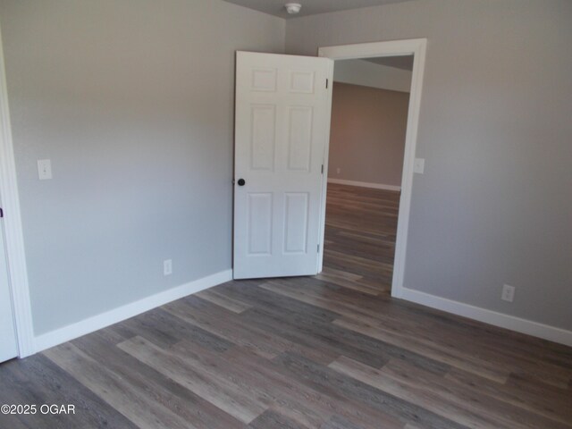 2705 S Michigan Ave, Joplin, MO 64804 - unfurnished room featuring wood finished floors and baseboards
