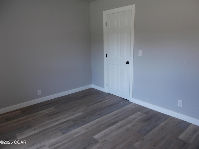 2705 S Michigan Ave, Joplin, MO 64804 - unfurnished room with baseboards and dark wood-style flooring