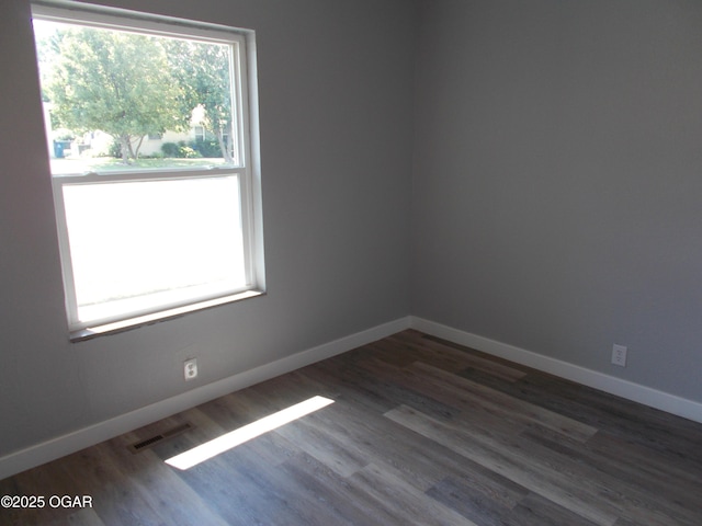 2705 S Michigan Ave, Joplin, MO 64804 - empty room featuring dark wood finished floors