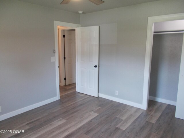 2705 S Michigan Ave, Joplin, MO 64804 - unfurnished bedroom featuring wood finished floors, a closet, and a ceiling fan
