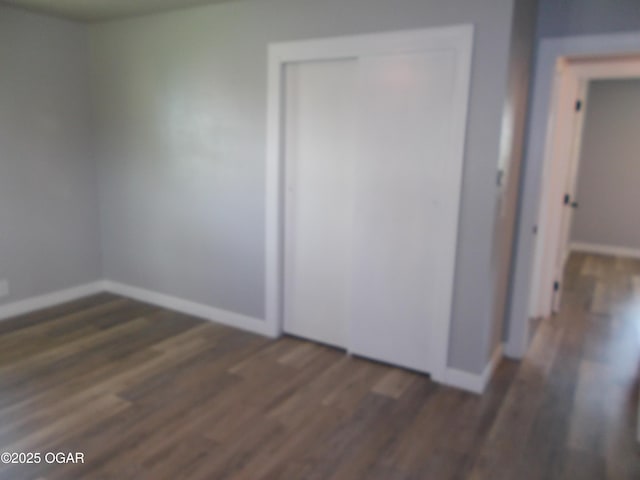 2705 S Michigan Ave, Joplin, MO 64804 - unfurnished bedroom with wood finished floors and a closet