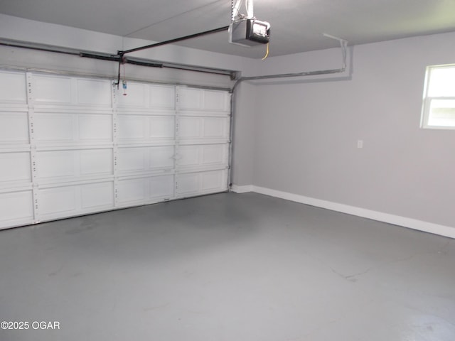 2705 S Michigan Ave, Joplin, MO 64804 - garage featuring a garage door opener and baseboards