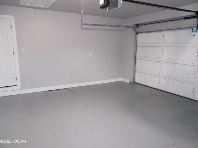 2705 S Michigan Ave, Joplin, MO 64804 - garage featuring a garage door opener and baseboards