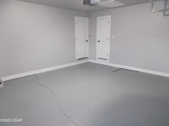 2705 S Michigan Ave, Joplin, MO 64804 - garage with a garage door opener and baseboards
