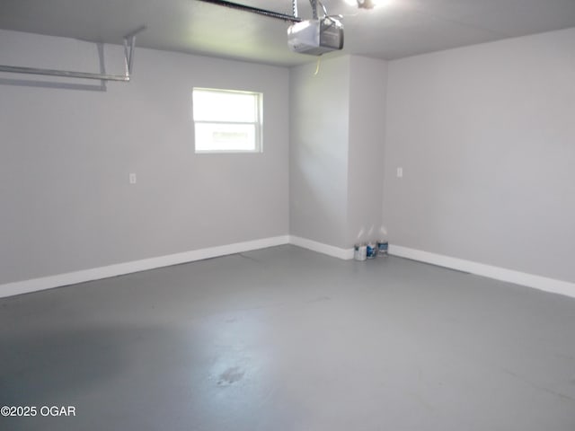 2705 S Michigan Ave, Joplin, MO 64804 - garage with a garage door opener and baseboards