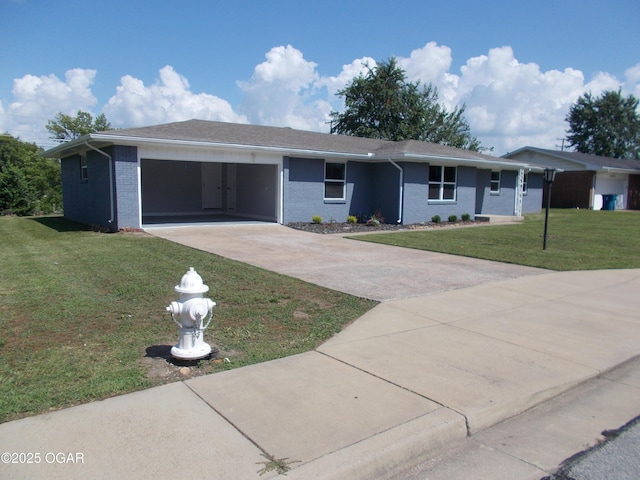 2705 S Michigan Ave, Joplin, MO 64804 - ranch-style home with concrete driveway, a garage, a front lawn, and brick siding