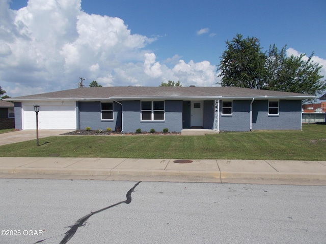 2705 S Michigan Ave, Joplin, MO 64804 - ranch-style house featuring a front lawn, an attached garage, driveway, and brick siding