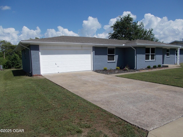 2705 S Michigan Ave, Joplin, MO 64804 - single story home with an attached garage, brick siding, concrete driveway, and a front lawn