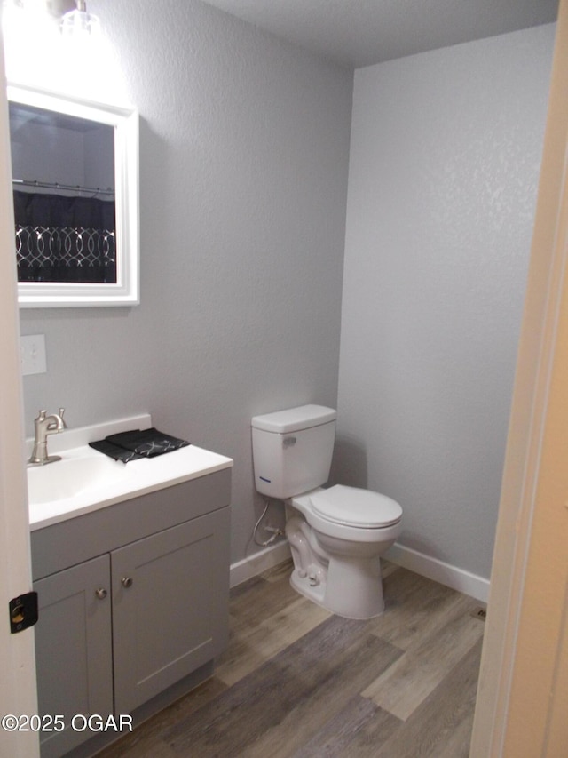 2705 S Michigan Ave, Joplin, MO 64804 - bathroom featuring vanity and wood finished floors