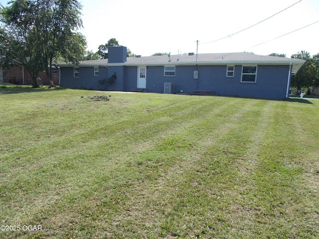 2705 S Michigan Ave, Joplin, MO 64804 - back of property with a chimney and a lawn