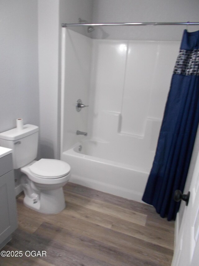 2705 S Michigan Ave, Joplin, MO 64804 - bathroom with vanity, wood finished floors, and shower / tub combo