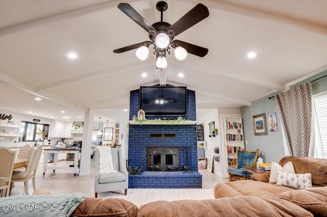 11284 Norway Rd, Neosho, MO 64850 - living area featuring a ceiling fan, light wood-style floors, a brick fireplace, and recessed lighting