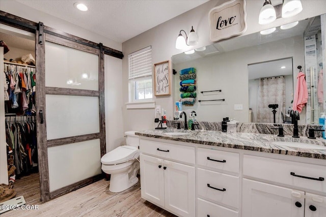 11284 Norway Rd, Neosho, MO 64850 - full bath with wood finished floors, double vanity, and a spacious closet