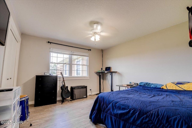 11284 Norway Rd, Neosho, MO 64850 - bedroom with light wood-style flooring and a textured ceiling