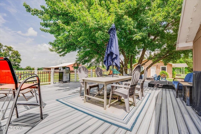 11284 Norway Rd, Neosho, MO 64850 - wooden deck with outdoor dining area and grilling area