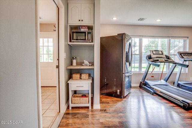11284 Norway Rd, Neosho, MO 64850 - exercise room featuring wood finished floors and recessed lighting