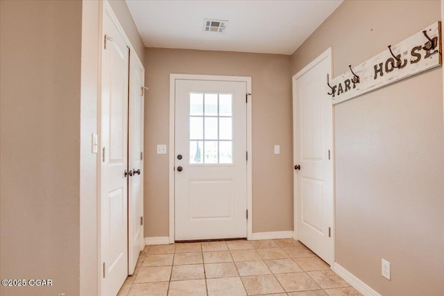 11284 Norway Rd, Neosho, MO 64850 - doorway to outside featuring baseboards and light tile patterned floors