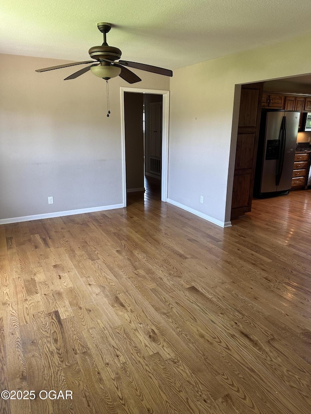 2223 Texas Ave, Joplin, MO 64804 - spare room with dark wood finished floors and ceiling fan