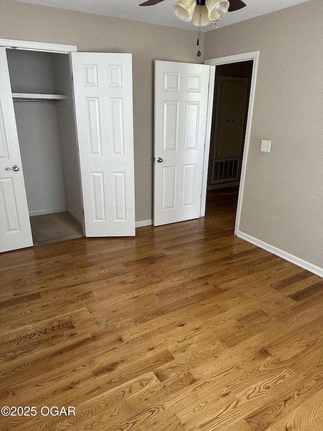 2223 Texas Ave, Joplin, MO 64804 - unfurnished bedroom with a closet, wood finished floors, and ceiling fan