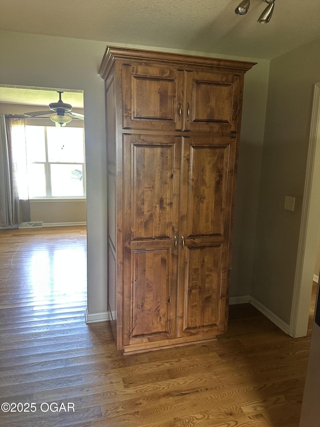 2223 Texas Ave, Joplin, MO 64804 - detailed view of wood finished floors and ceiling fan