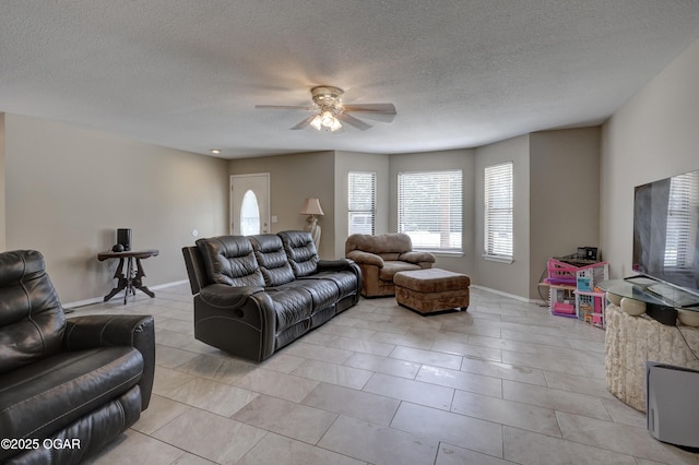 5223 County Lane 301, Joplin, MO 64801 - living area featuring ceiling fan, light tile patterned flooring, and a textured ceiling