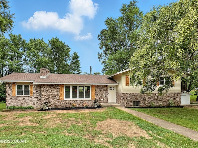 12807 Larissa Ln, Neosho, MO 64850 - split level home featuring a front yard, brick siding, and a chimney