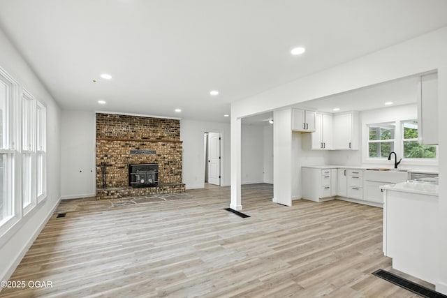 12807 Larissa Ln, Neosho, MO 64850 - unfurnished living room with light wood-style floors and recessed lighting
