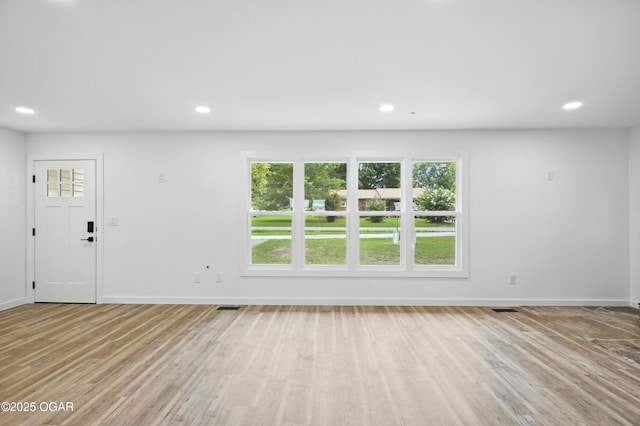 12807 Larissa Ln, Neosho, MO 64850 - unfurnished living room with wood finished floors and recessed lighting