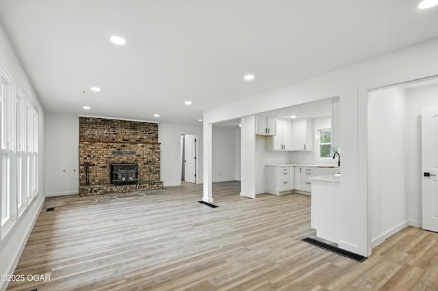 12807 Larissa Ln, Neosho, MO 64850 - unfurnished living room featuring light wood finished floors and recessed lighting