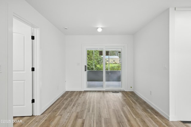 12807 Larissa Ln, Neosho, MO 64850 - unfurnished room with light wood-style floors and baseboards