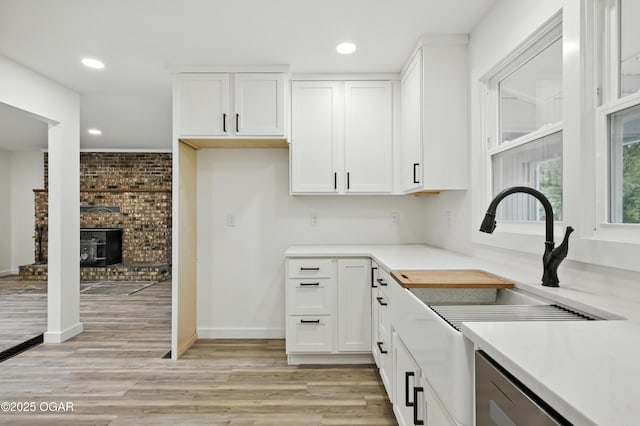 12807 Larissa Ln, Neosho, MO 64850 - kitchen featuring white cabinetry, recessed lighting, light wood-style flooring, light countertops, and dishwasher