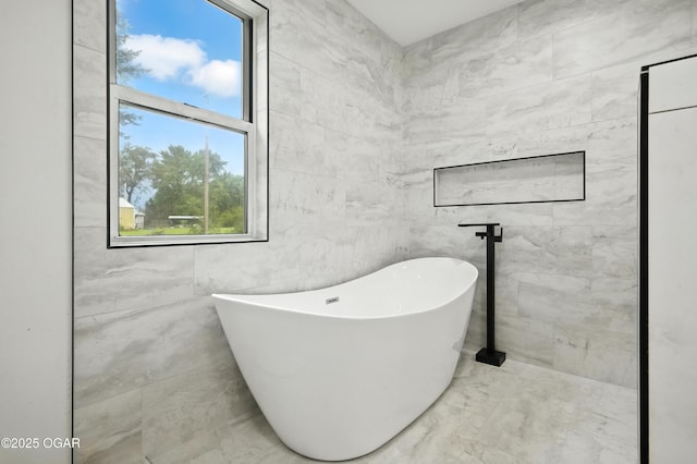 12807 Larissa Ln, Neosho, MO 64850 - bathroom with a freestanding bath and marble look tiles