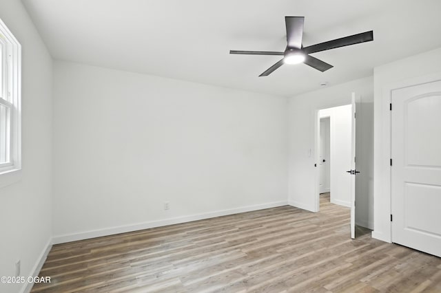 12807 Larissa Ln, Neosho, MO 64850 - unfurnished bedroom featuring light wood-type flooring and ceiling fan