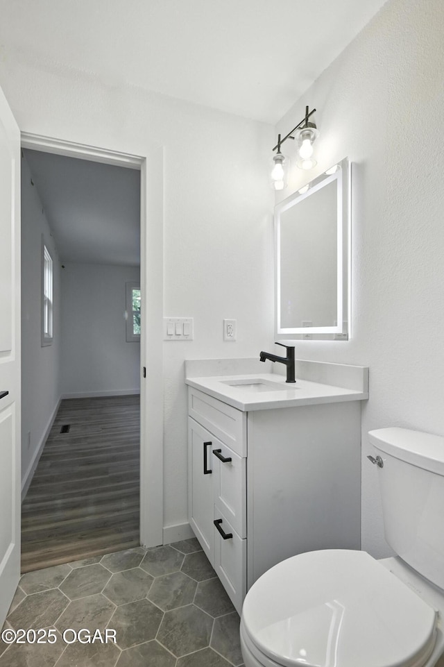 12807 Larissa Ln, Neosho, MO 64850 - half bathroom with vanity and tile patterned floors